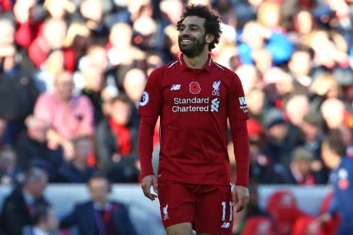 Mohamed Salah scored to keep Liverpool on Manchester City's coat tails with a 2-0 win over Fulham