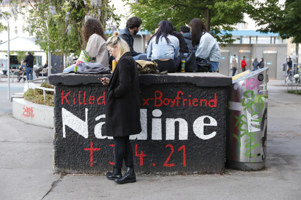 A memorial for Nadine, a woman who was killed on April 5 by her former partner, is set up at the on the Yppenplatz square in Vienna, Austria, Friday, May 14, 2021. Austria is one of the few European Union countries where the number of women killed is higher than the number of men. The recent high-profile cases have led to widespread protests, demands for government intervention and condemnations from top politicians. (AP Photo/Lisa Leutner)