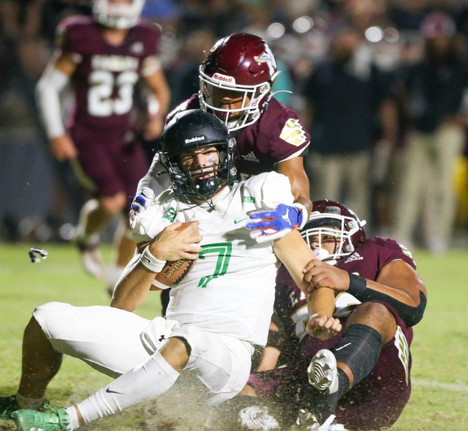 Niceville Maddox Hayles and Nathaniel Krider sack Choctaw QB Jesse Winslette for a loss during the Choctaw-Niceville football game played at Niceville.
