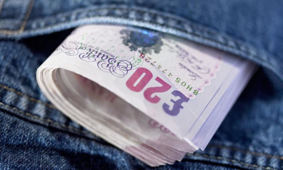 Twenty pound notes in a pocket