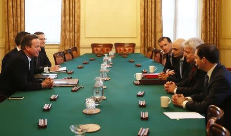 Britain's Prime Minister David Cameron (L) chairs a meeting about Tata Steel's British assets, attended by Business Secretary Sajid Javid (3rd R), the First Minister of Wales Carwyn Jones (2nd R), and Chancellor of the Exchequer George Osborne (R), at Number 10 Downing Street in London, Britain April 5, 2016. REUTERS/Stefan Wermuth