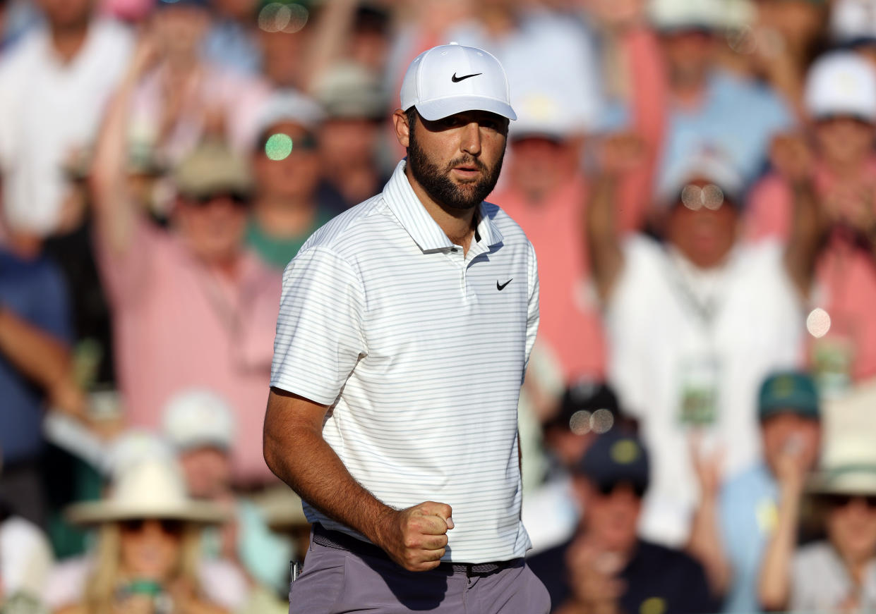 Scottie Scheffler pumps his fist after making birdie on the 18th hole during the third round of the 2024 Masters. (Warren Little/Getty Images)