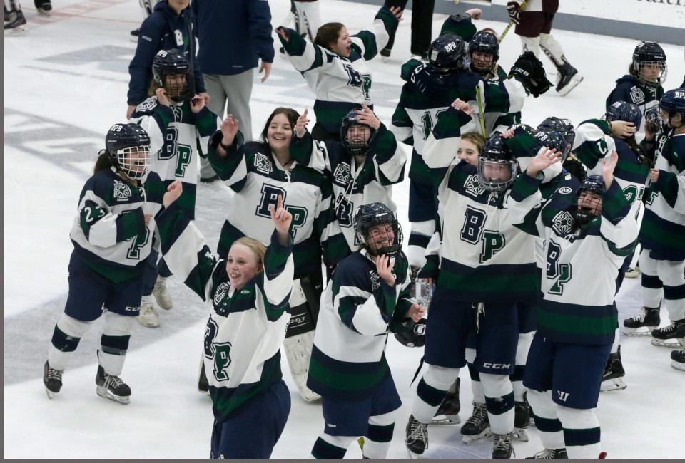 The Burrillville/Ponaganset/Bay View Co-op (BPB) girls hockey team looks to the stands to acknowledge their family and friends to help celebrate their Division 1 Girls hockey Championship win over La Salle Academy 3-2  at Providence College's Schneider Arena.