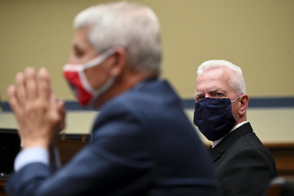 Assistant Secretary for Health Admiral Brett P. Giroir and Dr. Anthony Fauci, director of the National Institute of Allergy and Infectious Diseases, left, wear protective masks during during a House Select Subcommittee hearing on the Coronavirus, Friday, July 31, 2020 on Capitol Hill in Washington. (Erin Scott/Pool via AP)