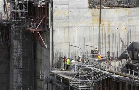 Workers are seen at the construction site of the Panama Canal Expansion project on the Atlantic side on the outskirts of Colon City January 15, 2014. REUTERS/Carlos Jasso