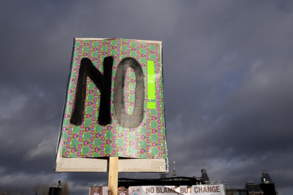 Hundreds of people protested in Amsterdam, Netherlands, Saturday, Jan. 29, 2022, in a #MeToo demonstration sparked by allegations of sexual improprieties linked to a popular Dutch TV talent show. The demonstration on Amsterdam's Museumplein square was organized following reports of inappropriate sexual behavior, ranging from WhatsApp messages to an allegation of rape, linked to "The Voice of Holland." (AP Photo/Peter Dejong)