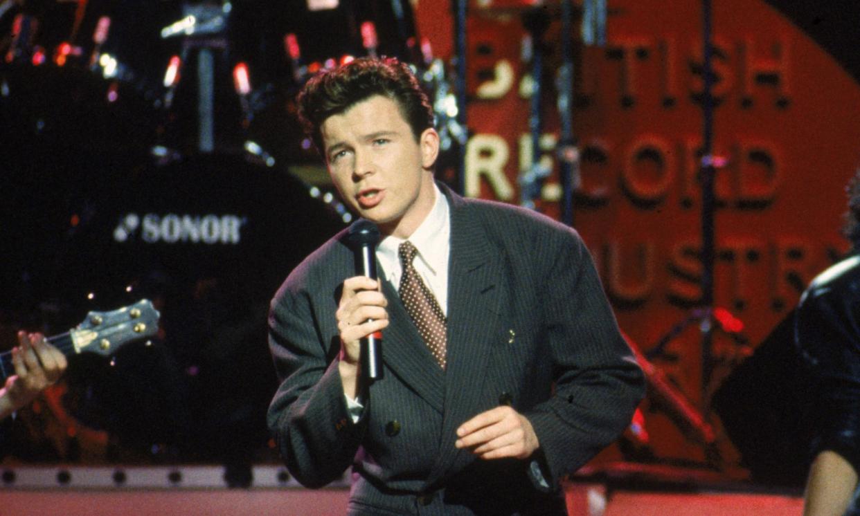 <span>Rick Astley performing at the BPI Awards in 1986.</span><span>Photograph: Dave Hogan/Getty</span>