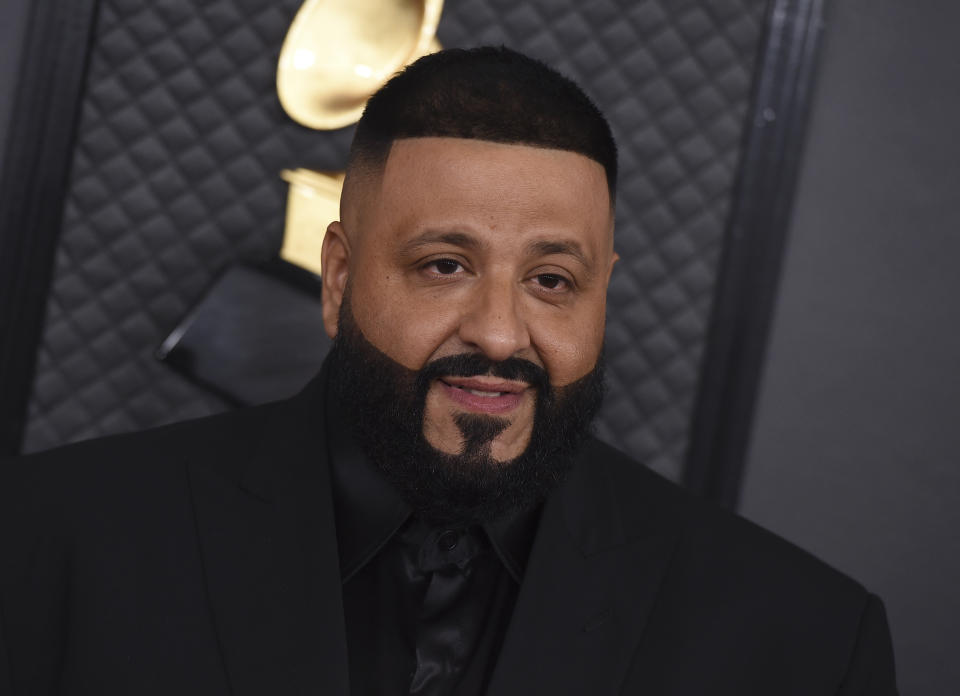 FILE - This Jan. 26, 2020 file photo shows DJ Khaled at the 62nd annual Grammy Awards in Los Angeles. Miami's hometown hero DJ Khaled surprised fans with an all-star lineup that included Rick Ross, Lil Wayne and Migos during the EA Sports Bowl at Bud Light Super Bowl Music Fest. (Photo by Jordan Strauss/Invision/AP, File)