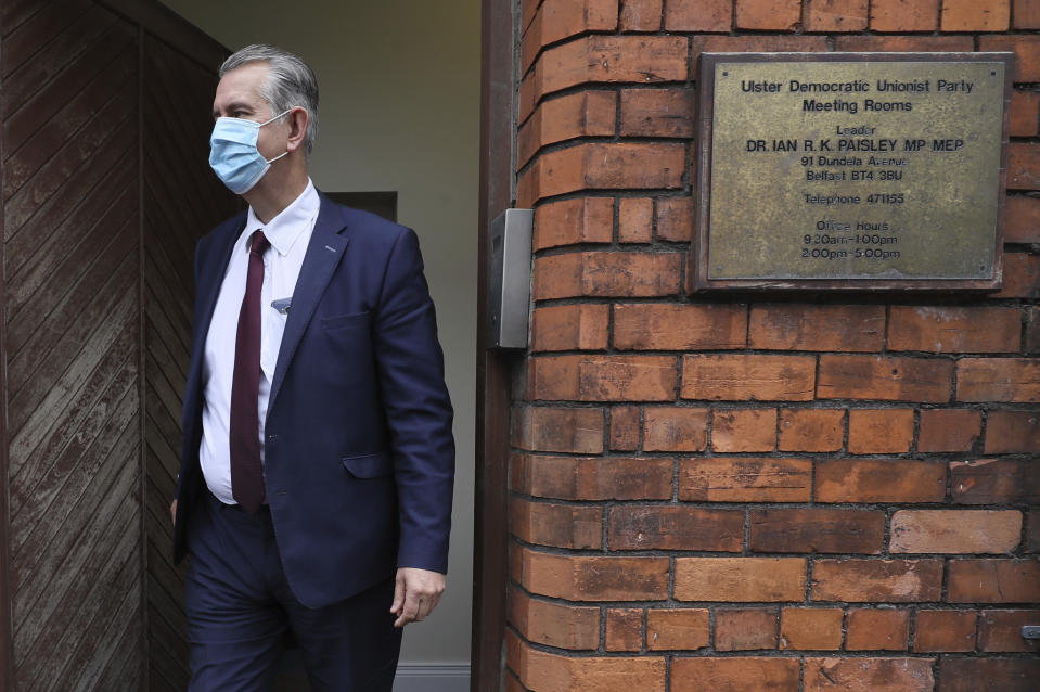 Edwin Poots the Northern Ireland Minister of Agriculture, Environment, and Rural Affairs (DAERA), leaves the Democratic Unionist Party (DUP) headquarters in Belfast, Northern Ireland, after voting in the party's leadership election, Friday May 14, 2021. Northern Ireland’s largest British unionist party is choosing a new leader Friday, in a contest between Northern Ireland Agriculture Minister Edwin Poots and lawmaker Jeffrey Donaldson, with only 36 eligible voters and the result due late Friday afternoon.(Brian Lawless/PA via AP)