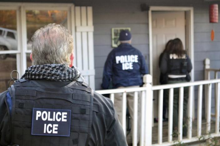 U.S. Immigration and Customs Enforcement provided this photo of ICE agents waiting at a home in Atlanta on Feb. 9, 2017, during a crackdown on immigration fugitives, re-entrants and criminal aliens. The Homeland Security Department said Feb. 13 that 680 people had been arrested in roundups in the previous week targeting immigrants living illegally in the United States. (Photo: Bryan Cox/ICE via AP)