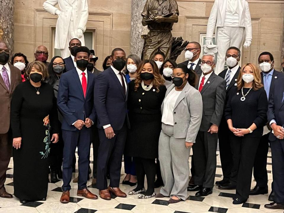 Rep. Shelia Cherfilus-McCormick and her family pose with members of the Congressional Black Caucus after her swearing-in ceremony.