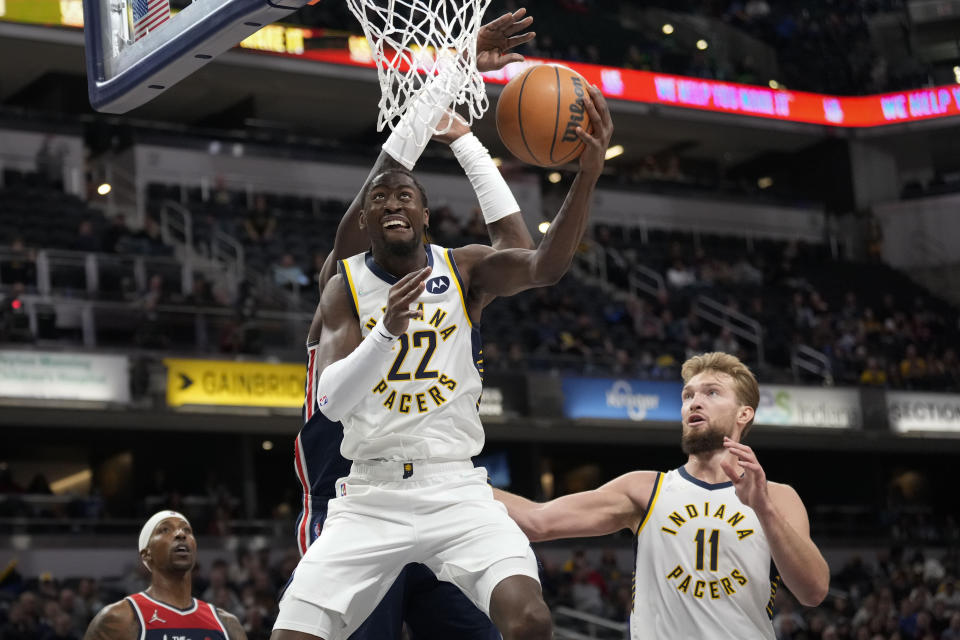 Indiana Pacers guard Caris LeVert (22) shoots in front of Washington Wizards center Montrezl Harrell during the second half of an NBA basketball game in Indianapolis, Monday, Dec. 6, 2021. (AP Photo/AJ Mast)
