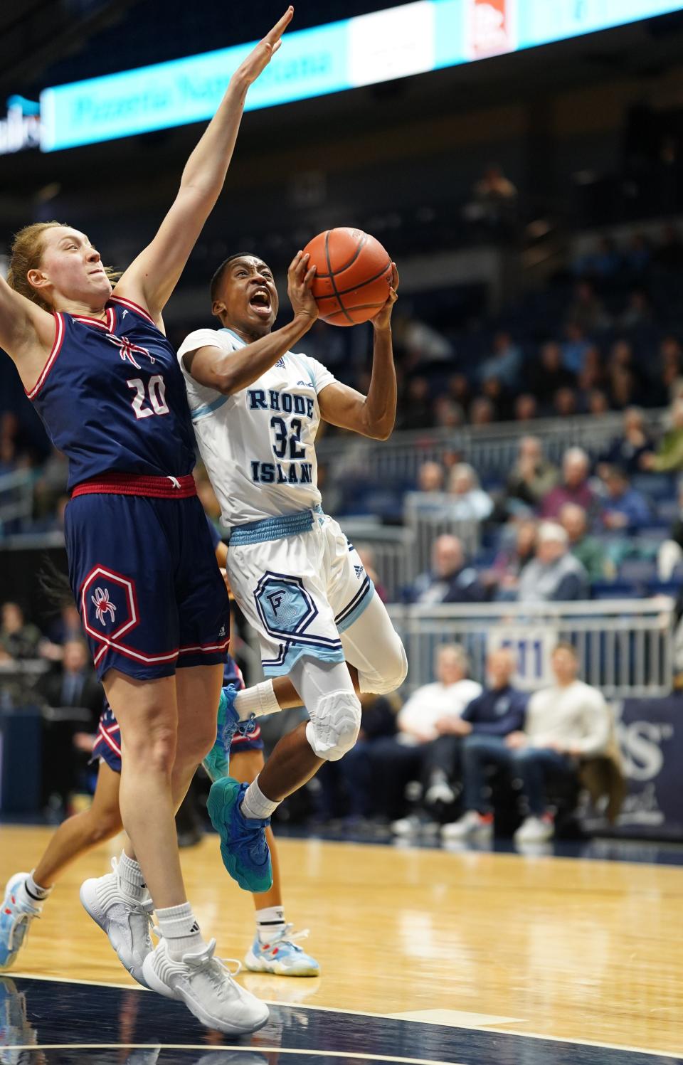 URI's Dee Dee Davis goes up for a shot against a Richmond player during a game earlier this month. Injuries have hurt the Rams all season.