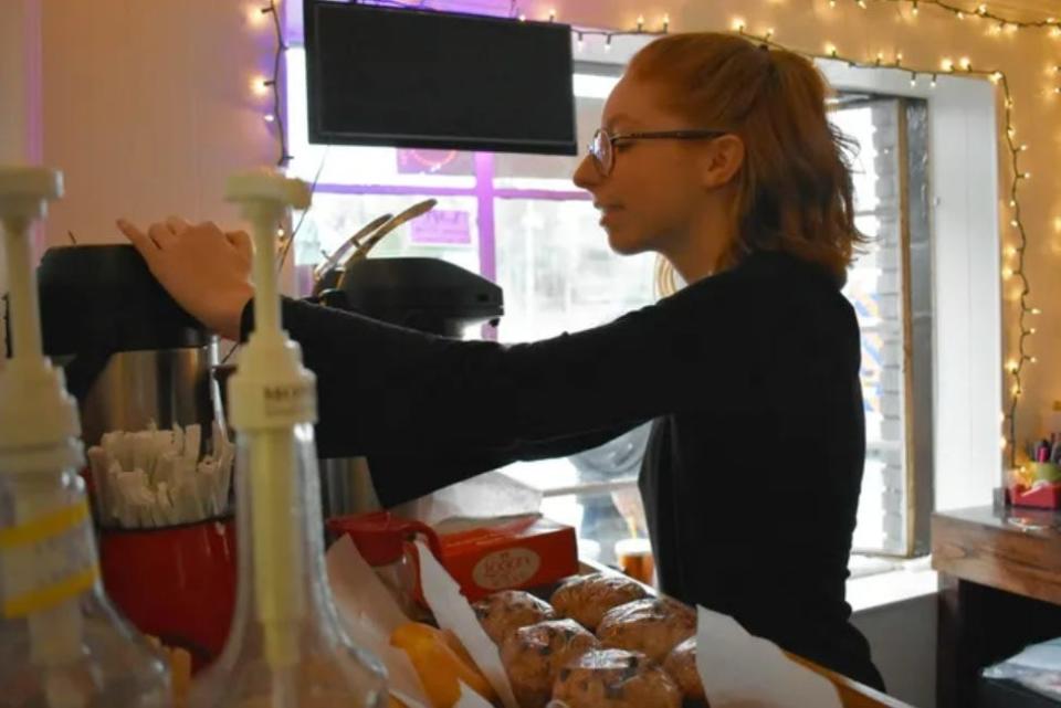 A barista gets a drink ready for a customer at Appalachian Coffee Company in Laurel Park in this file photo.