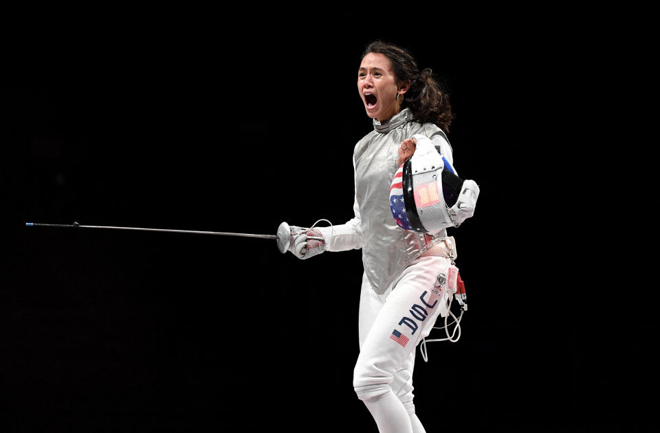 <p>Team USA's Lee Kiefer celebrates as she makes history as the first American woman to win a medal in individual foil. Not only did she place, she won gold at the Makuhari Messe Hall on July 25.</p>