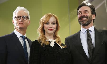 "Mad Men" stars (L-R) John Slattery, Christina Hendricks and Jon Hamm take part in a donation ceremony at the Smithsonian National Museum of American History in Washington March 27, 2015. REUTERS/Kevin Lamarque