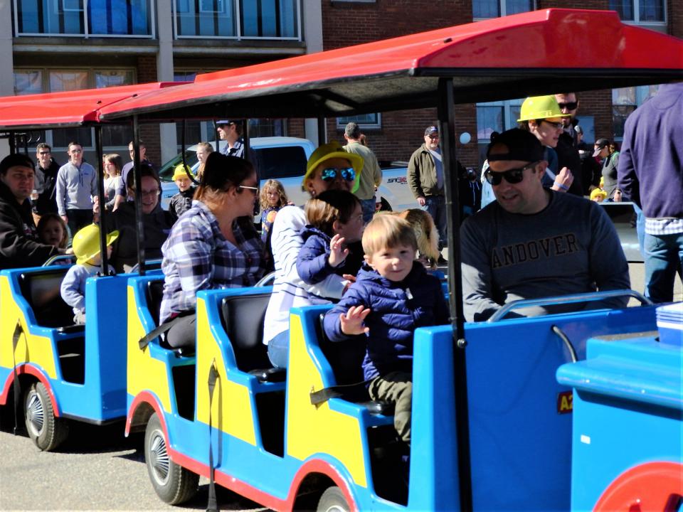 Children and their parents are welcome to ride around the exterior of lower Henry Law Park on a miniature Thomas the Tank Engine train driven by Conductor Dan of the Roaming Railroad during Apple Harvest Day in Dover Saturday, Oct. 7, 2023.