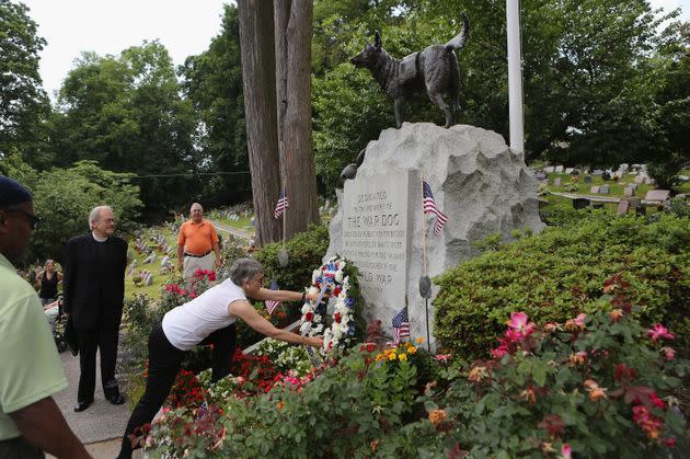 A wreath of flowers is laid at the cemetery's War Dog Memorial during the annual memorial service for military working dogs on June 10, 2012. (Photo: John Moore via Getty Images)