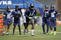 Seattle Seahawks wide receiver DK Metcalf (14) runs a practice drill during NFL football training camp, Wednesday, Aug. 12, 2020, in Renton, Wash. (AP Photo/Ted S. Warren, Pool)