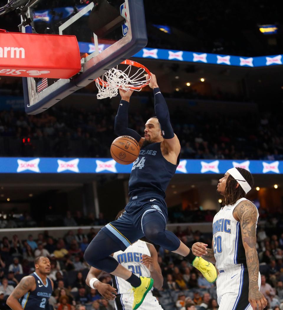 The Memphis Grizzlies forward Dillon Brooks (24) dunks the ball against the Orlando Magic guard Markelle Fultz (20) during a game at the FedEx Forum in Memphis on March. 28, 2023. 