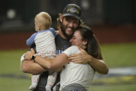 Los Angeles Dodgers starting pitcher Clayton Kershaw celebrates with family after defeating the Tampa Bay Rays 3-1 to win the baseball World Series in Game 6 Tuesday, Oct. 27, 2020, in Arlington, Texas. (AP Photo/Eric Gay)