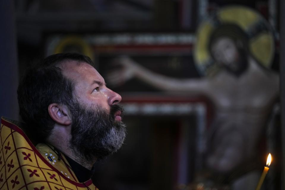 Russian Orthodox Priest the Rev. Andrei Kordochkin attends a religion service at the Russian Cathedral of Saint Mary Magdalene in Madrid, Spain, Saturday, July 15, 2023. In February, Moscow's Patriarch Kirill suspended Kordochkin, a priest at an Orthodox church in Madrid, after he condemned the Kremlin's decision to send troops to Ukraine. Church officials said Kordochkin was punished for "inciting hatred" among his parishioners, but the priest argues it's a warning to dissuade him from further criticism. (AP Photo/Paul White)