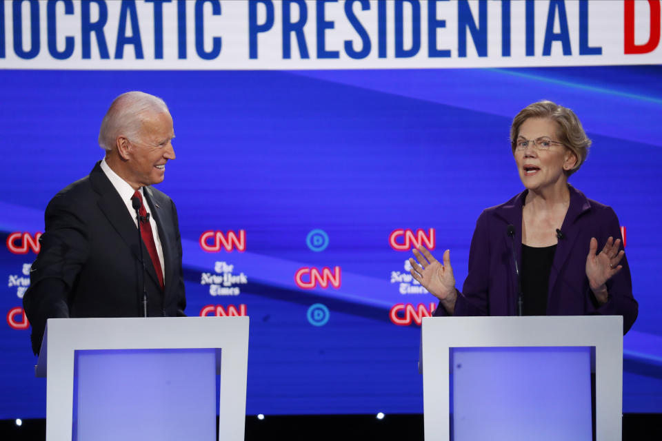 Democratic presidential candidate former Vice President Joe Biden, left, and Sen. Elizabeth Warren, D-Mass., participate in a Democratic presidential primary debate hosted by CNN/New York Times at Otterbein University, Tuesday, Oct. 15, 2019, in Westerville, Ohio. (AP Photo/John Minchillo)