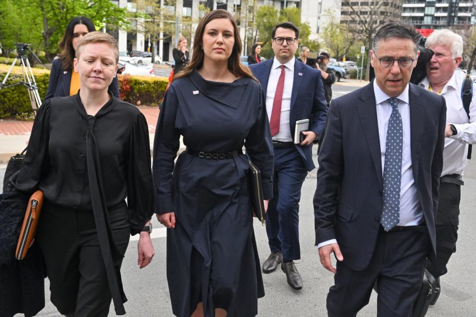 Former Liberal staffer Brittany Higgins (centre) arrives at the Australian Capital Territory Supreme Court in Canberra (AP)