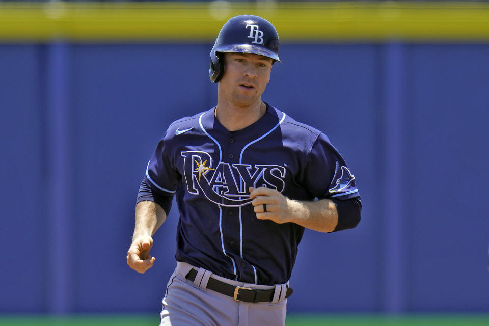 Tampa Bay Rays' Joey Wendle runs around the bases after his grand slam off Toronto Blue Jays starting pitcher Trent Thornton during the first inning of a baseball game Monday, May 24, 2021, in Dunedin, Fla. (AP Photo/Chris O'Meara)