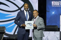 Orlando Magic president of basketball operation Jeff Weltman, left, stands with NBA deputy commissioner Mark Tatum after Tatum announced that the Magic have won the first pick in the 2022 NBA Draft during the 2022 NBA basketball Draft Lottery Tuesday, May 17, 2022, in Chicago. (AP Photo/Charles Rex Arbogast)