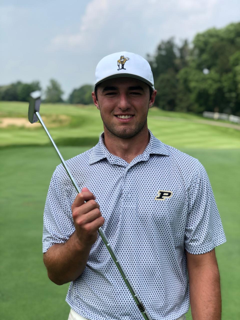 Andrew Farraye with his Bell putter