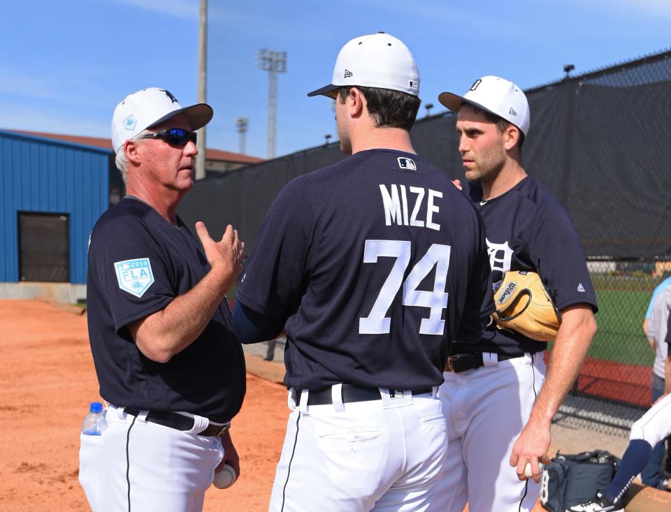 Detroit Tigers pitching coach Rick Anderson, left, talks with pitchers Casey Mize, center, and Matthew Boyd during spring training workouts at the Tiger Town Complex on Feb. 15, 2019, in Lakeland, Fla.