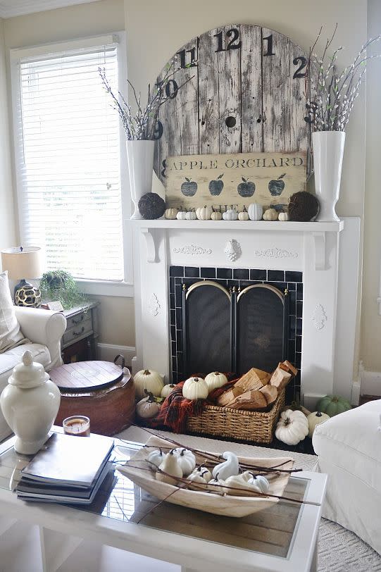 <p>Blogger Liz Marie Galvan proves that a layered display in neutral tones can be just as festive as a colorful one for the fall season. To recreate this look for your own home, let a DIY rustic sign sit front and center of your display.</p><p><strong>See more at <a href="http://www.lizmarieblog.com/2014/09/fall-mantel-lmb-rental/" rel="nofollow noopener" target="_blank" data-ylk="slk:Liz Marie Blog;elm:context_link;itc:0;sec:content-canvas" class="link ">Liz Marie Blog</a>.</strong> </p>