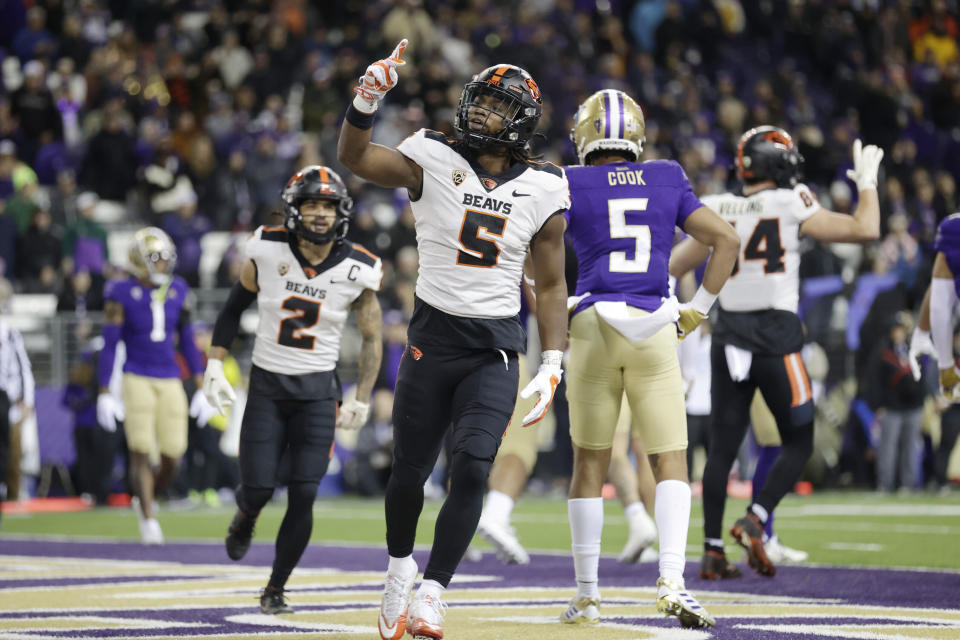 Oregon State running back Deshaun Fenwick (5) celebrates after scoring against Washington during the first half of an NCAA college football game Friday, Nov. 4, 2022, in Seattle. (AP Photo/John Froschauer)