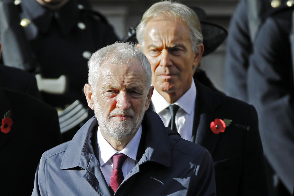 Former Prime Minister Tony Blair (R) stands behind Britain's opposition Labour Party Leader Jeremy Corbyn at the Remembrance Sunday ceremony at the Cenotaph on Whitehall in central London, on November 11, 2018. - On the 100th anniversary of the World War I armistice, the day's events mark the final First World War Centenary commemoration events hosted by the UK Government. Services are held annually across Commonwealth countries during Remembrance Day to commemorate servicemen and women who have fallen in the line of duty since WWI. (Photo by Tolga AKMEN / AFP)        (Photo credit should read TOLGA AKMEN/AFP via Getty Images)