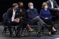 From left to right, former player Dirk Nowitzki, from left, his wife Jessica, former President George Bush and wife Laura Bush, watch as the Brooklyn Nets play the Dallas Mavericks in the first half of an NBA basketball game in Dallas, Thursday, May 6, 2021. (AP Photo/Tony Gutierrez)