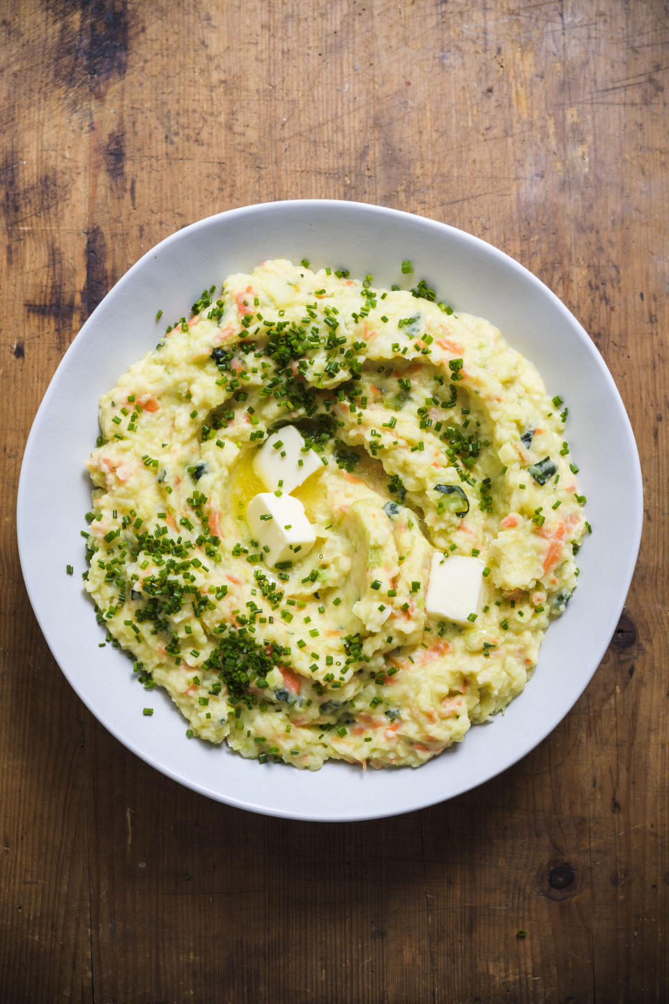 This image released by Milk Street shows a recipe for Belgian mashed potatoes with winter vegetables. (Milk Street via AP)