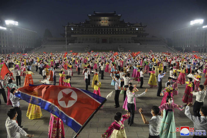 FILE - In this photo provided by the North Korean government, youth gather to celebrate the 69th anniversary of the signing of the ceasefire armistice that ends the fighting in the Korean War, is held in Pyongyang, North Korea, July 27, 2022. Independent journalists were not given access to cover the event depicted in this image distributed by the North Korean government. The content of this image is as provided and cannot be independently verified. Korean language watermark on image as provided by source reads: "KCNA" which is the abbreviation for Korean Central News Agency. On Saturday, July 30, 2022, North Korea reported no new fever cases for the first time since it abruptly admitted to its first domestic COVID-19 outbreak and placed its 26 million people under more draconian restrictions in May. (Korean Central News Agency/Korea News Service via AP, File)