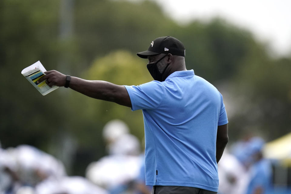 Los Angeles Chargers head coach Anthony Lynn points to a player during an NFL football camp practice, Monday, Aug. 17, 2020, in Costa Mesa, Calif. (AP Photo/Jae C. Hong)