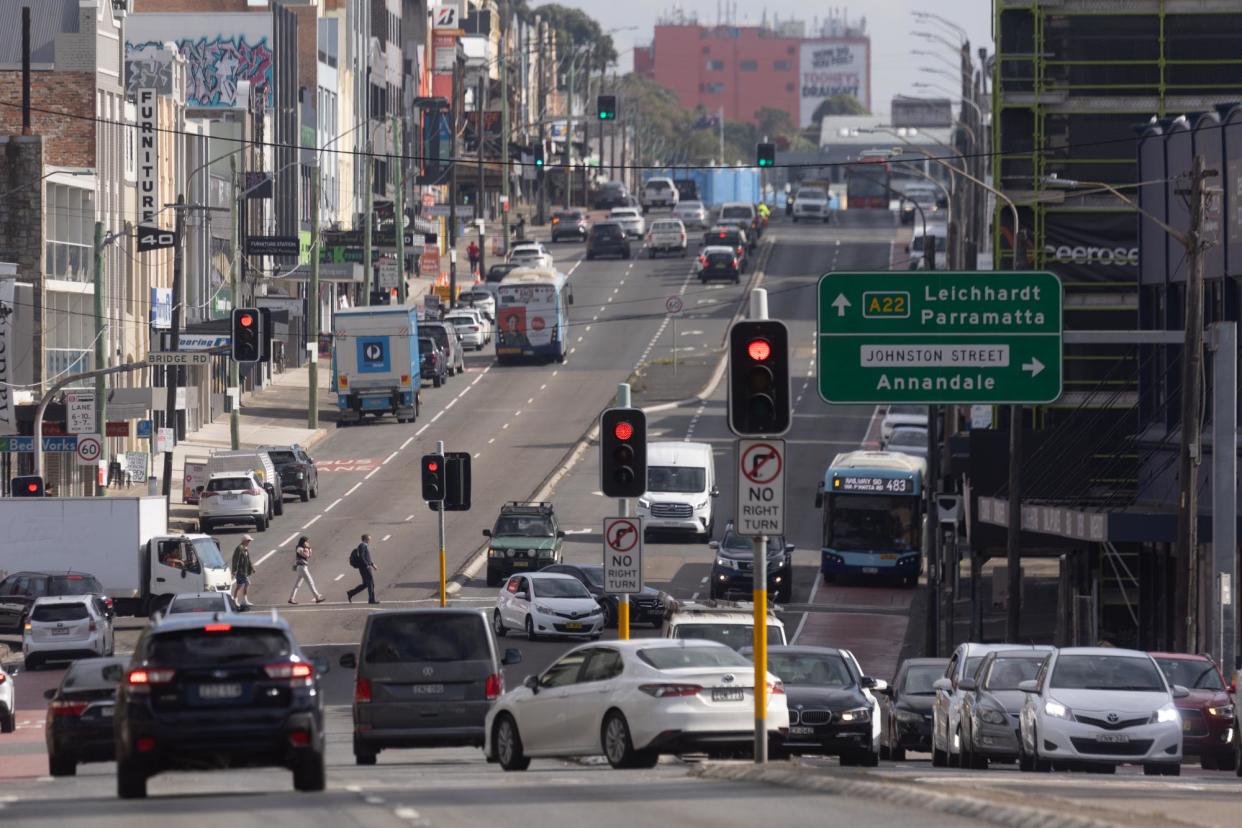 <span>With congestion, noise and tailpipe pollution more prominent than ever, it’s mostly car yards, speciality outlets such as bridal shops and a smattering of pubs and other services that remain on Parramatta Road – besides beyond the For Lease signs.</span><span>Photograph: Mike Bowers/The Guardian</span>