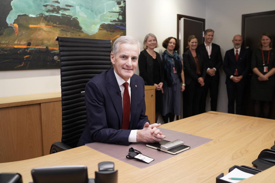 Norway's new Prime Minister Jonas Gahr Store sits in his office in Oslo, Thursday Oct. 14, 2021. Jonas Gahr Store takes over Thursday from the Conservative Party’s Prime Minister Erna Solberg, who was ousted in the Sept. 13 election after two four-year terms. (Cornelius Poppe/NTB via AP)