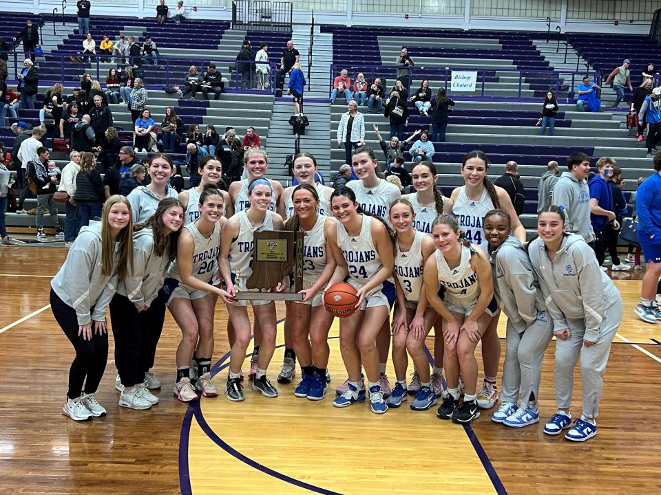 Bishop Chatard girls basketball pose with the Class 3A regional trophy after beating Indian Creek on Saturday at Greencastle.