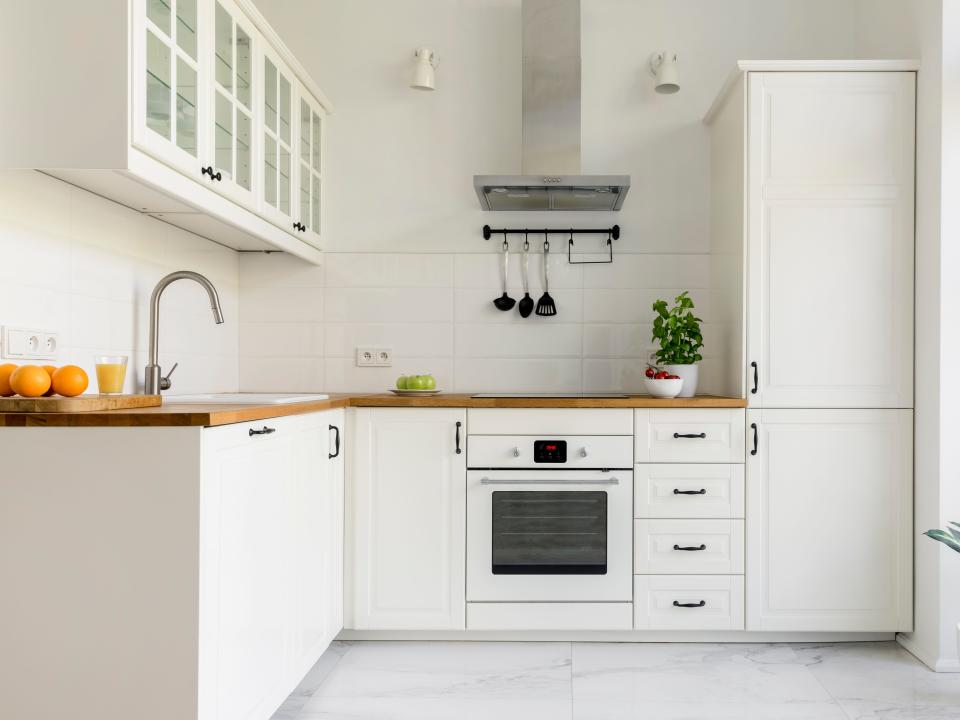 white minimal kitchen with white appliances