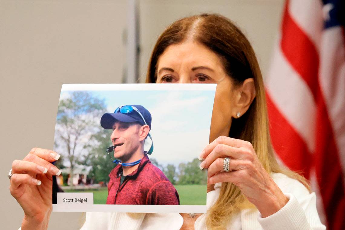 Linda Beigel Schulman holds a photograph of her son, Scott Beigel, before giving her victim impact statement during the penalty phase of the trial of Marjory Stoneman Douglas High School shooter Nikolas Cruz at the Broward County Courthouse in Fort Lauderdale on Monday, Aug. 1, 2022. Scott Beigel was killed in the 2018 shootings. Cruz previously pleaded guilty to all 17 counts of premeditated murder and 17 counts of attempted murder in the 2018 shootings. 