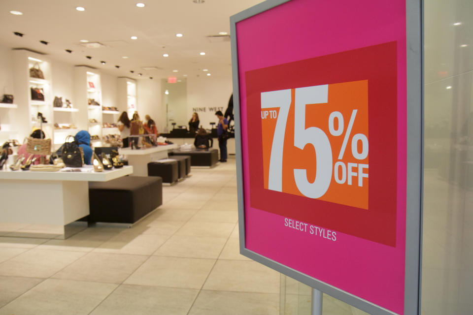 75% off sign in the entrance to Nine West. (Photo by: Jeffrey Greenberg/Universal Images Group via Getty Images)