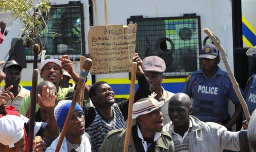 Striking workers of the Anglo American Platinum (Amplats) move from shaft to shaft to call on their colleagues to stop working in Rustenburg, on September 12. Two of the world's top mining giants toughened their line against striking S.African workers, with one threatening to sack employees and the other warning of plant closures if stoppages continued