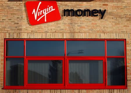 Signs are seen on the front of the Virgin Money office in Norwich, south east England November 19, 2011. REUTERS/Darren Staples