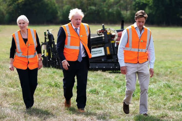 Boris Johnson and Nadine Dorries visit Henbury Farm in north Dorset, where Wessex Internet company is laying fibre optics in the field. (Photo: BEN BIRCHALL via Getty Images)