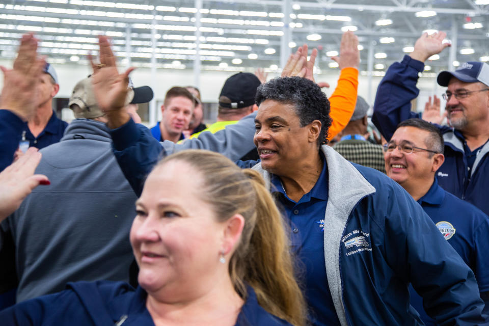 Drivers give high-fives at a Walmart hiring event in Casa Grande, Arizona. 