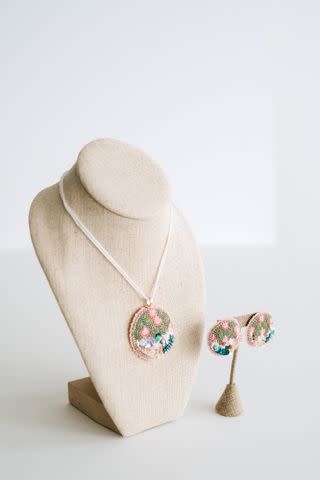 <p>Necklace and Earrings by Kathryn Hopkins, Photo by Brooks and Co.</p>